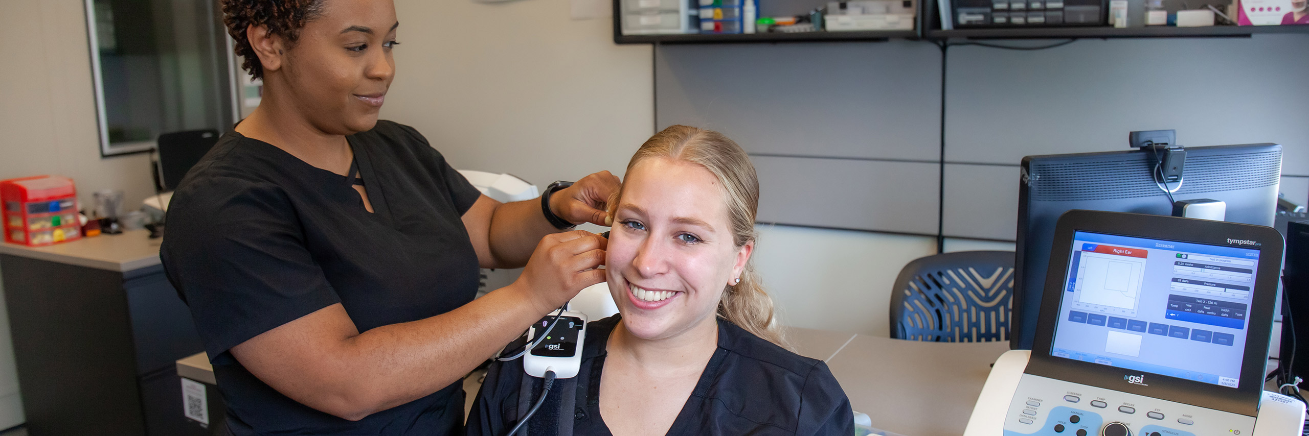 Professional doing a hearing exam on a patient